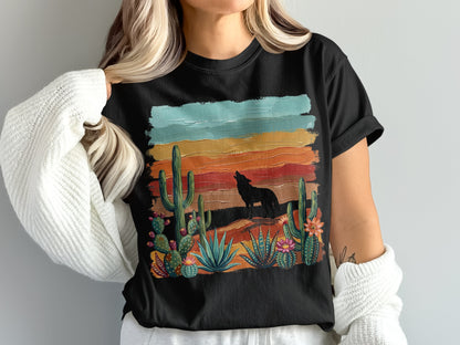 Black t-shirt with desert landscape, cactus, and wolf silhouette design.
