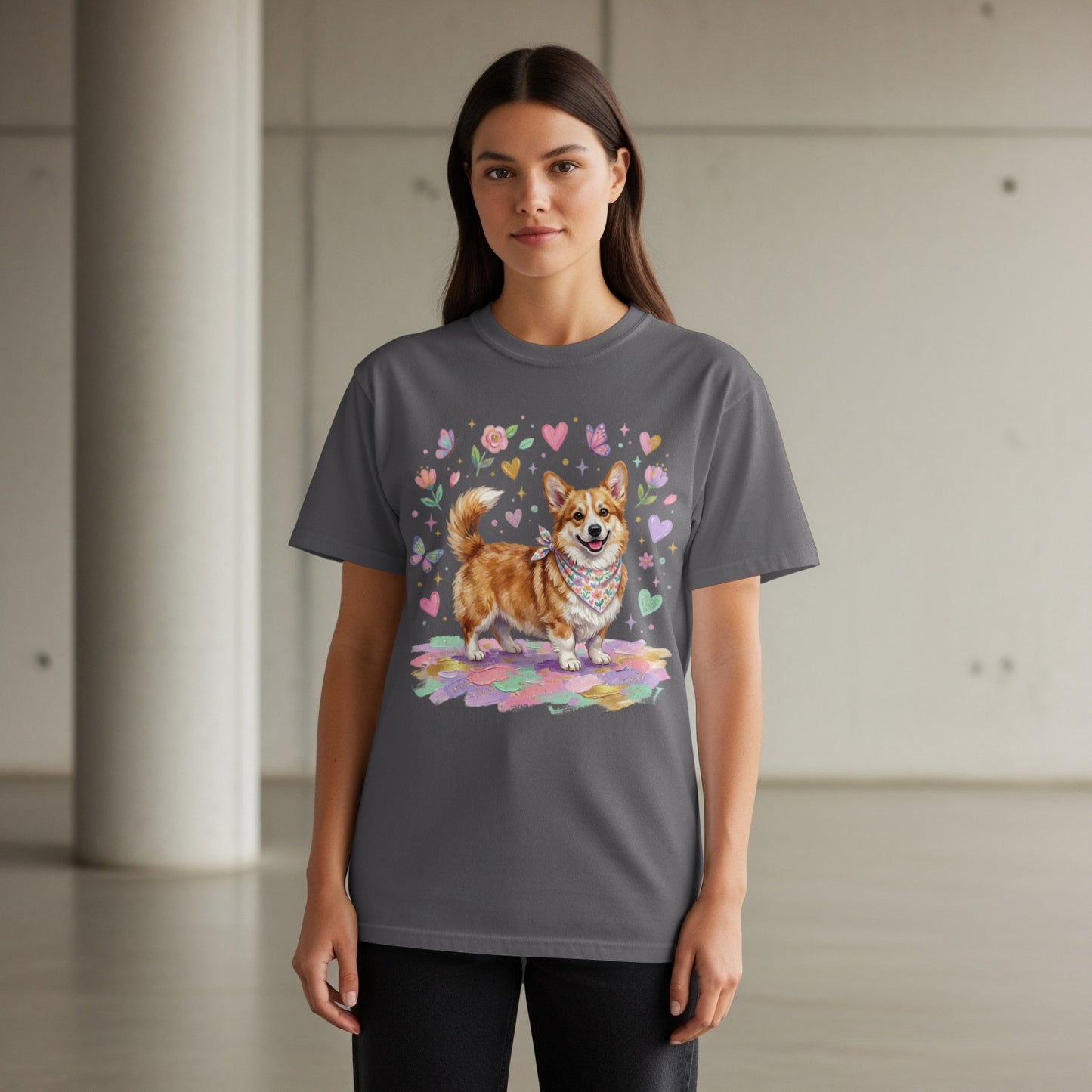 Dark grey t-shirt featuring a happy corgi wearing a bandana, surrounded by hearts and flowers.
