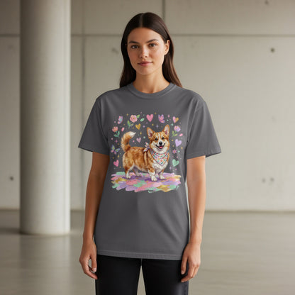 Dark grey t-shirt featuring a happy corgi wearing a bandana, surrounded by hearts and flowers.