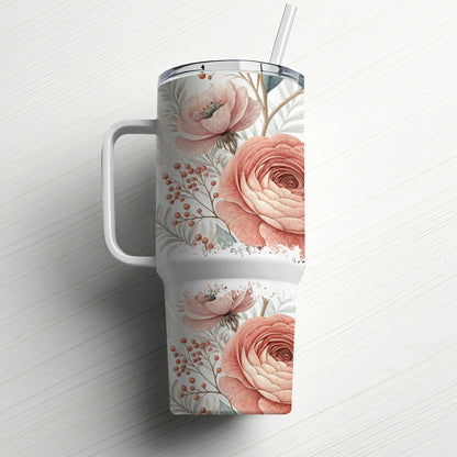 White tumbler with pink floral and berry pattern, and a straw.