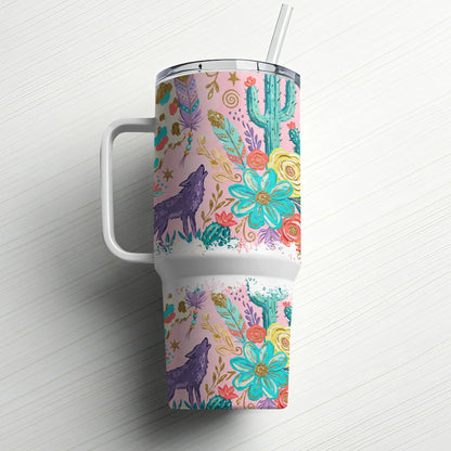 Pink tumbler with wolf, cactus, and floral desert design, includes straw.