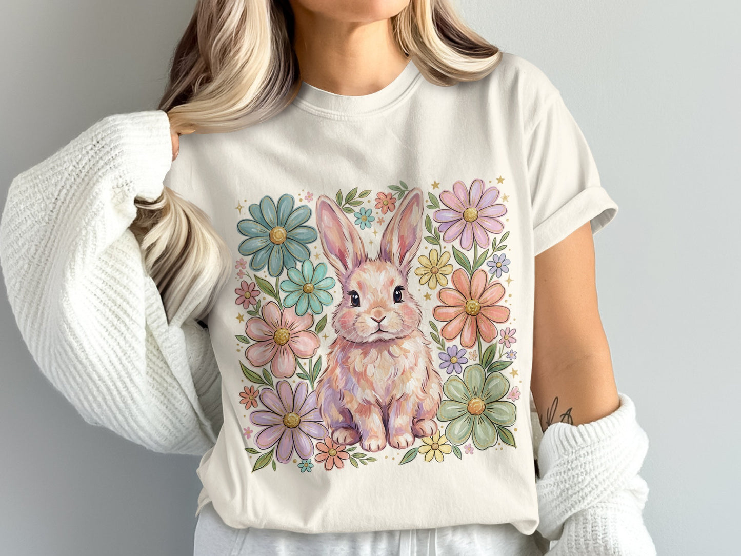 T-shirt with a pastel bunny surrounded by colorful flowers.