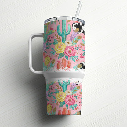 Pink floral and cactus tumbler with cow print lid and straw.