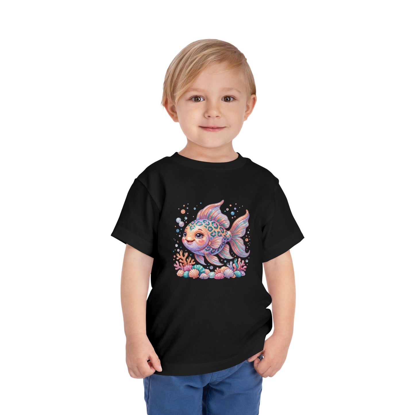 Child wearing black t-shirt with a colorful cartoon fish and coral print.