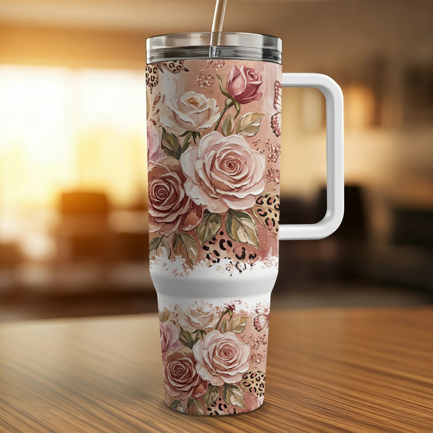 Floral and leopard print tumbler with handle and straw.