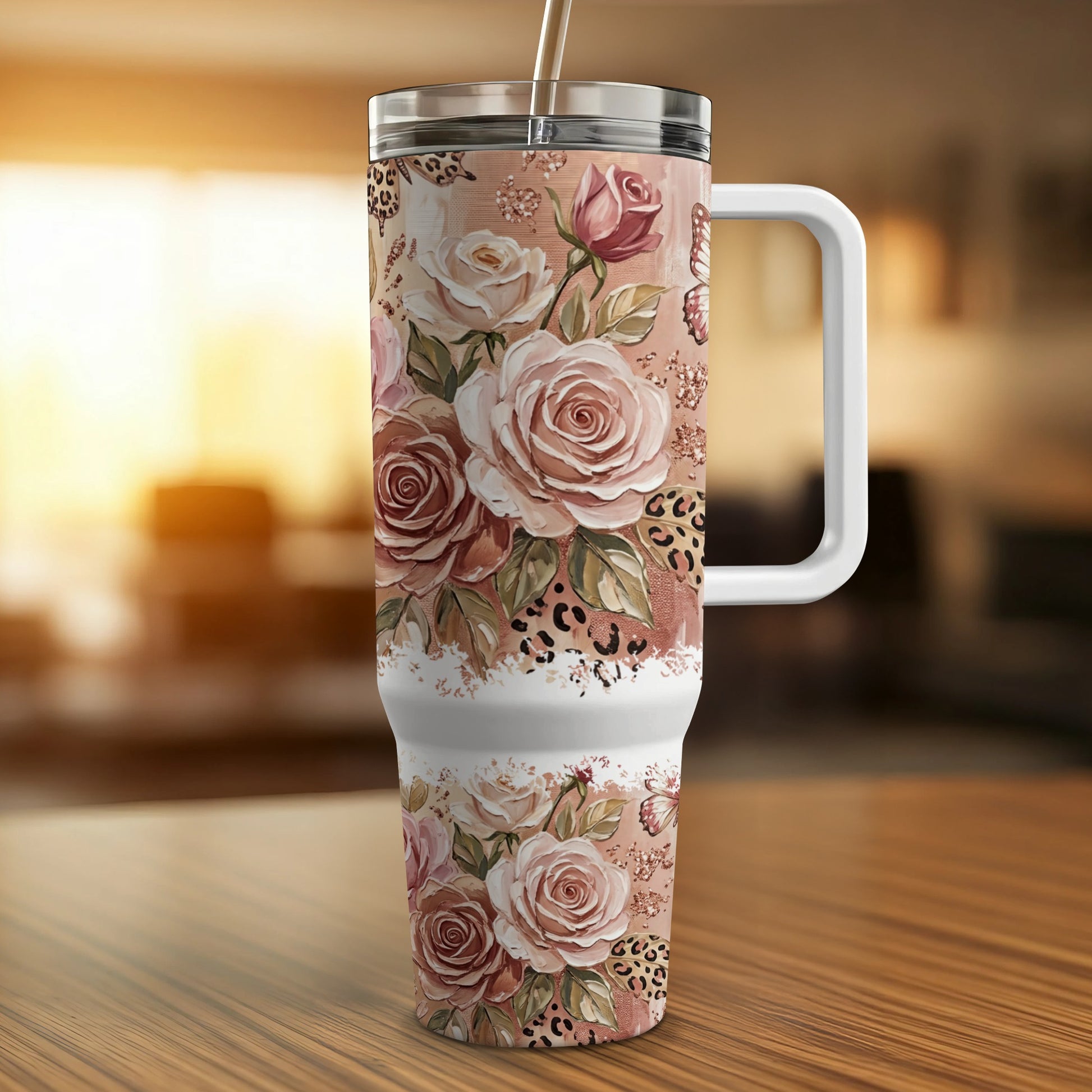 Floral and leopard print tumbler with handle and straw.