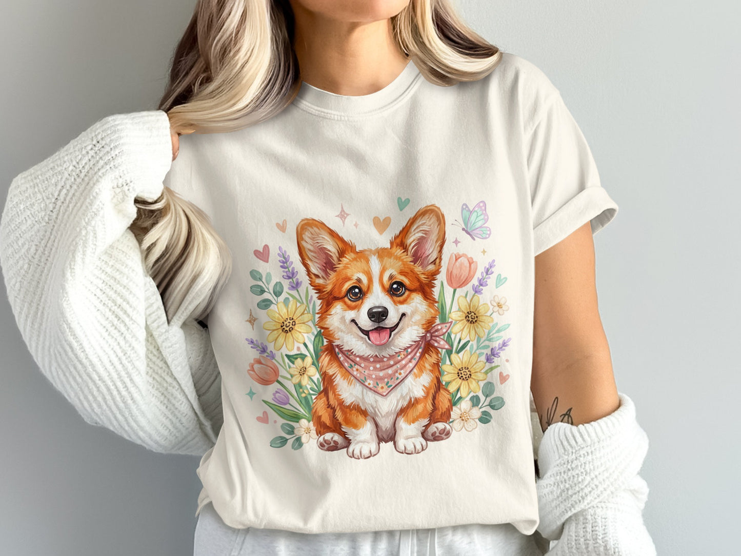 Cream t-shirt with smiling corgi and floral watercolor illustration.