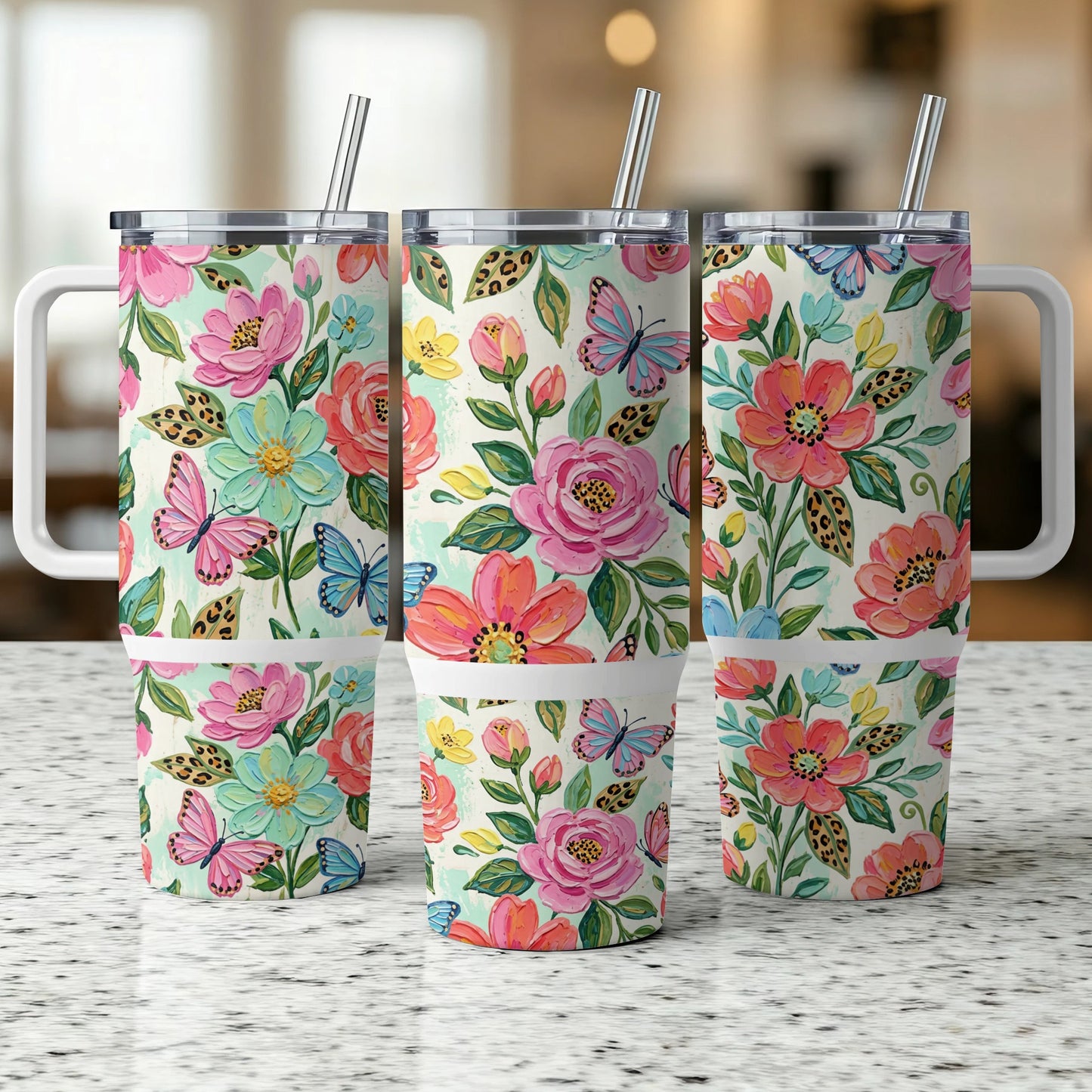 Three tumblers with a floral and butterfly design.