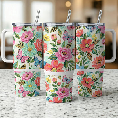 Three tumblers with a floral and butterfly design.