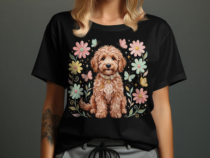 Black t-shirt featuring a fluffy brown dog surrounded by flowers and butterflies.