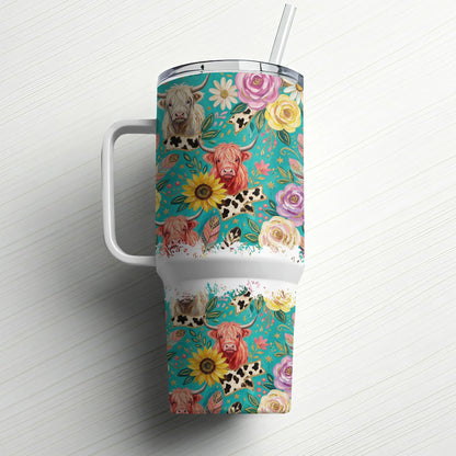 Tumbler with highland cows, sunflowers, and roses on a turquoise floral background.