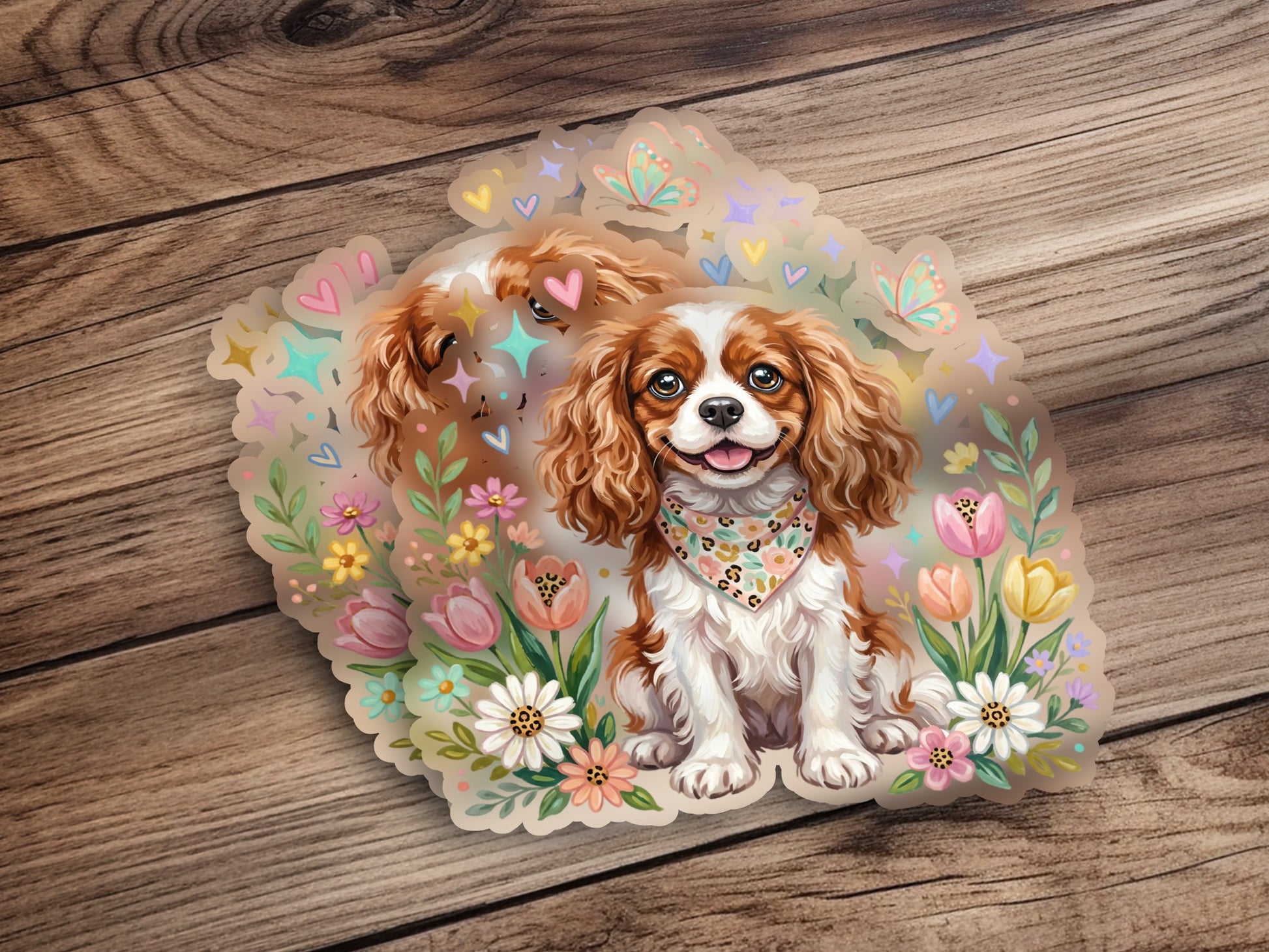Cavalier King Charles Spaniel wearing bandana surrounded by flowers and butterflies.