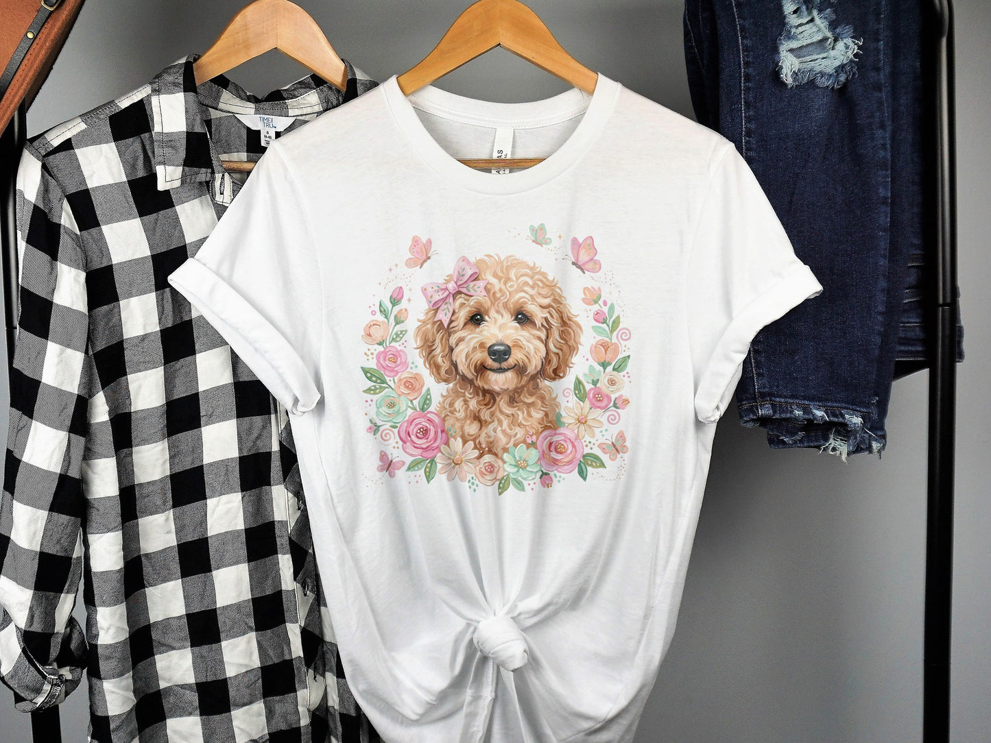 White t-shirt with a floral watercolor painting of a golden doodle dog.