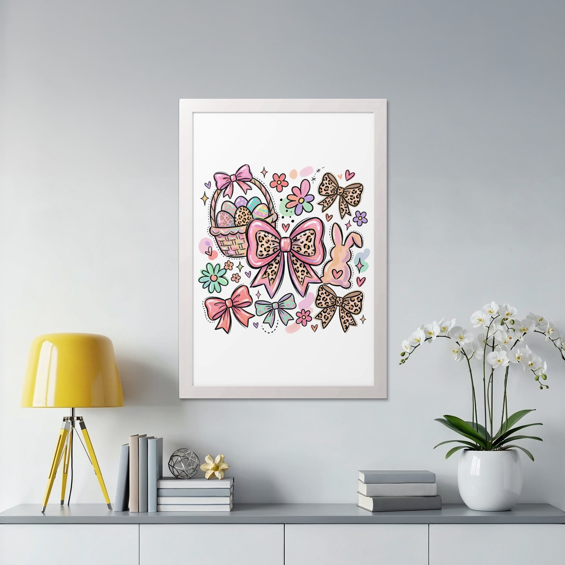 Easter art with bunnies, bows, and Easter eggs on a shelf.