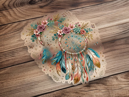 Dreamcatcher with floral accents, feathers, and butterflies on a wooden background.