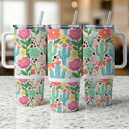 Three tumblers with a floral, cactus, and cow skull pattern.