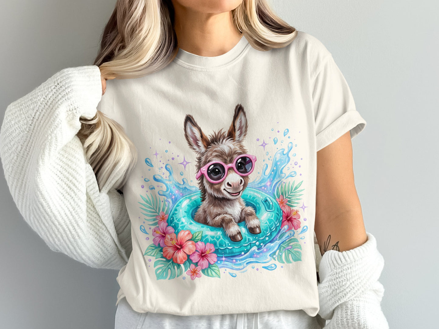 Cute donkey wearing pink sunglasses in a blue inner tube with flowers.
