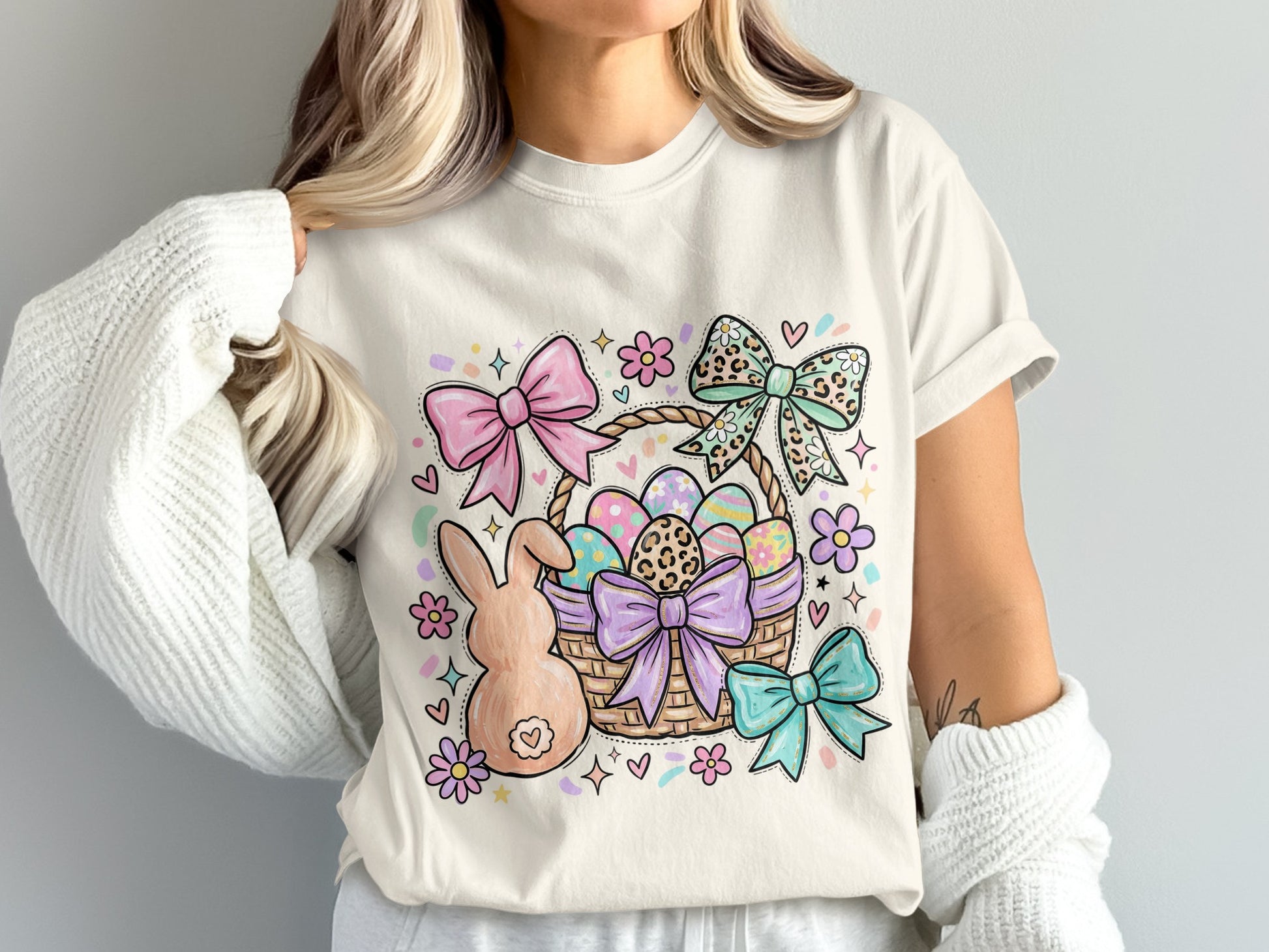 Easter basket with painted eggs, bunny, flowers, and bows.