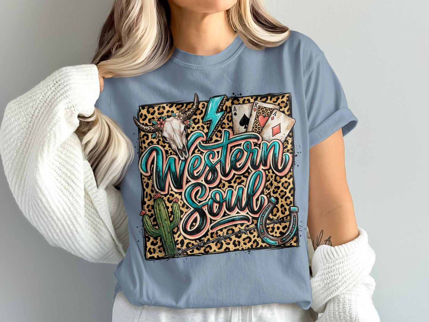 T-shirt with leopard print, cow skull, cactus, and playing cards.