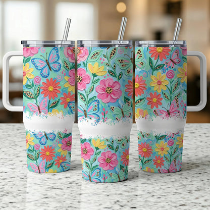 Three tumblers with floral and butterfly designs, featuring leopard print accents.