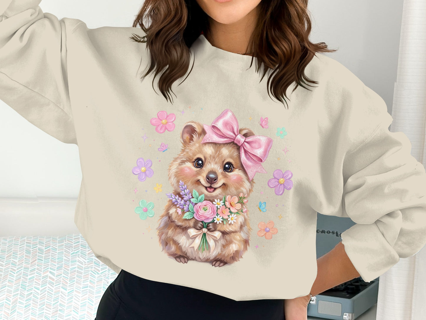 Quokka wearing pink bow holding a bouquet of flowers with butterflies.