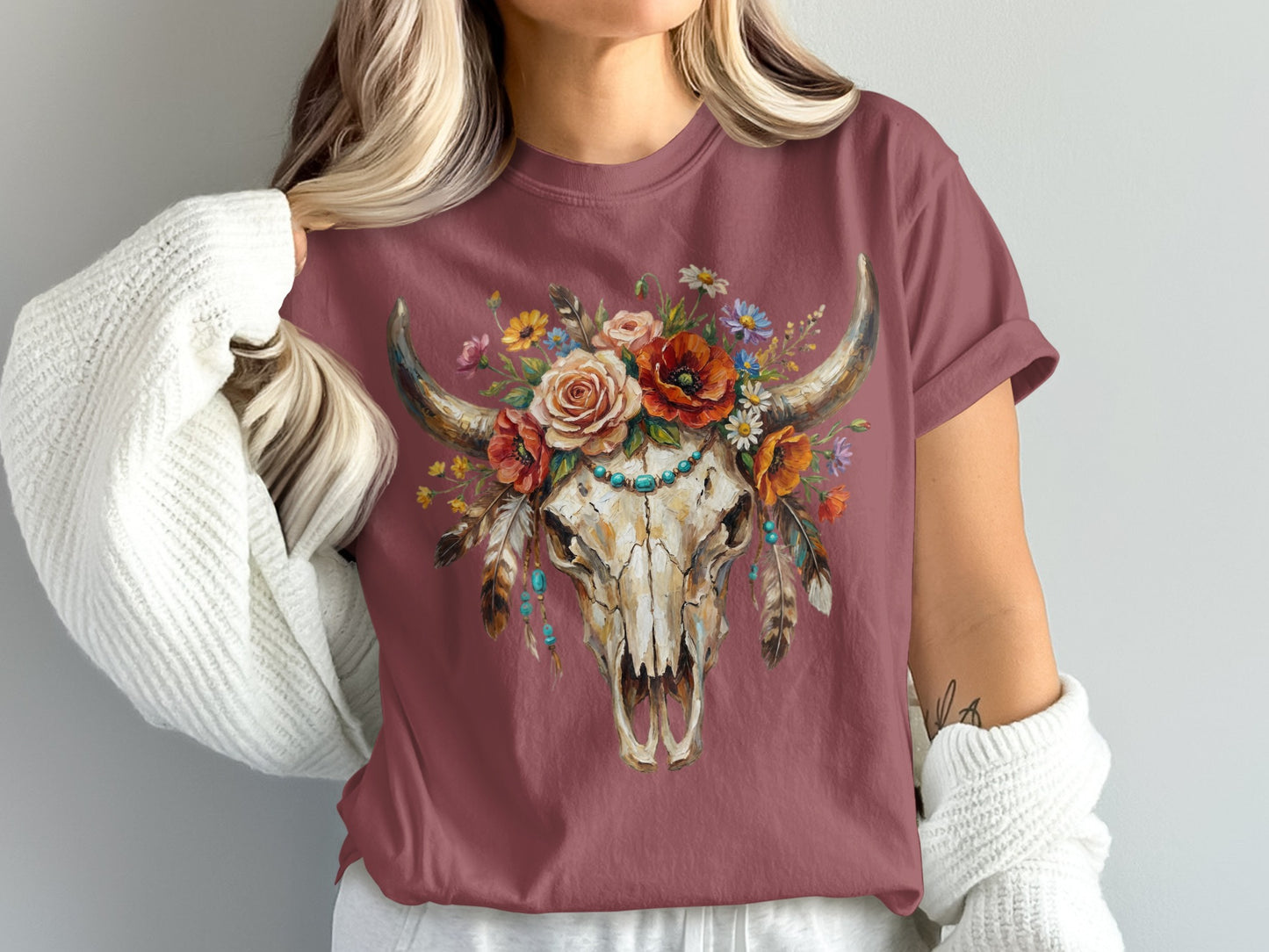 Burgundy t-shirt with floral bull skull graphic.
