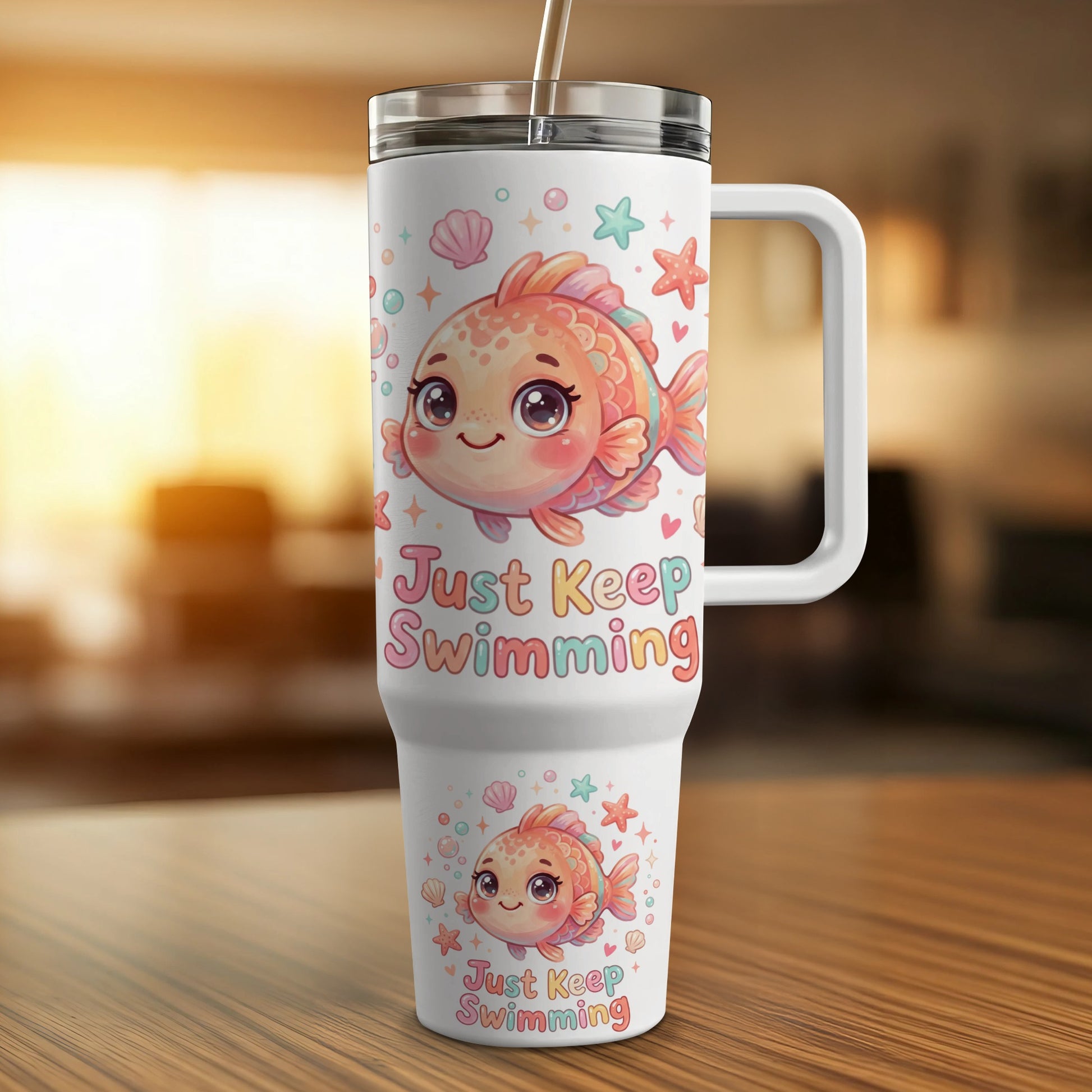 White tumbler with cartoon fish and "Just Keep Swimming" text.