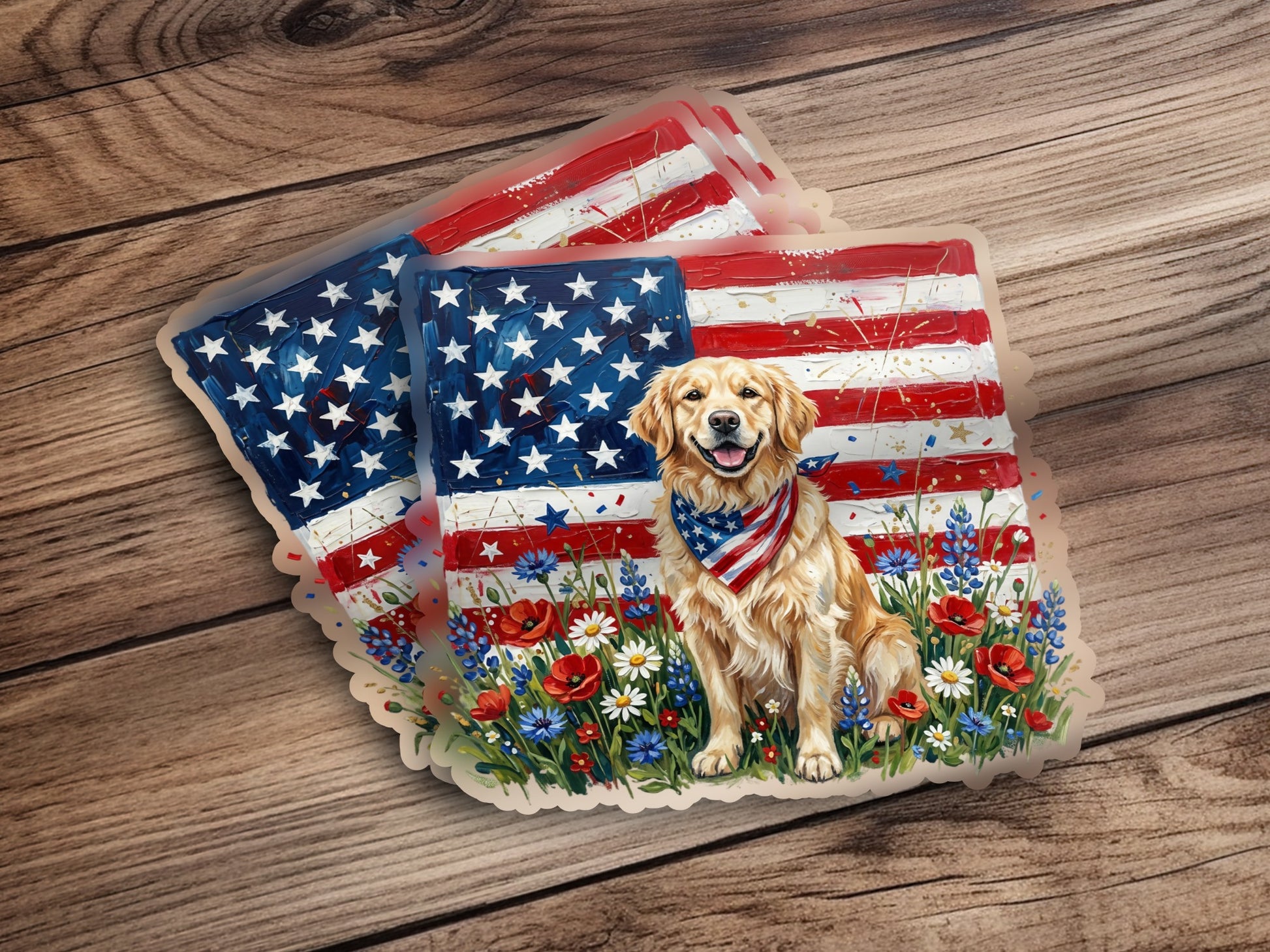 Golden retriever wearing bandana sits in field of wildflowers with American flag background.