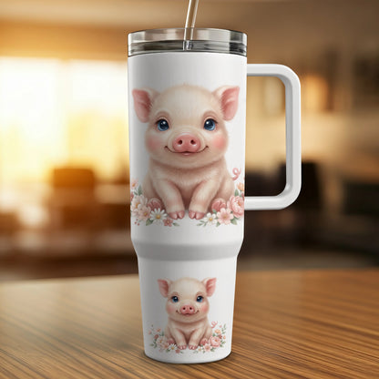 White tumbler with two smiling pigs and floral accents.