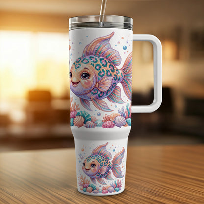White tumbler with two smiling leopard-spotted goldfish and colorful seashells.