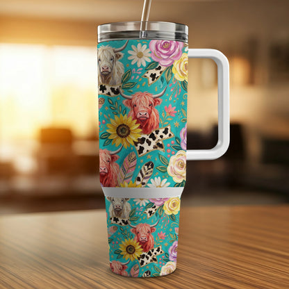 Turquoise tumbler with Highland cows, sunflowers, and roses.