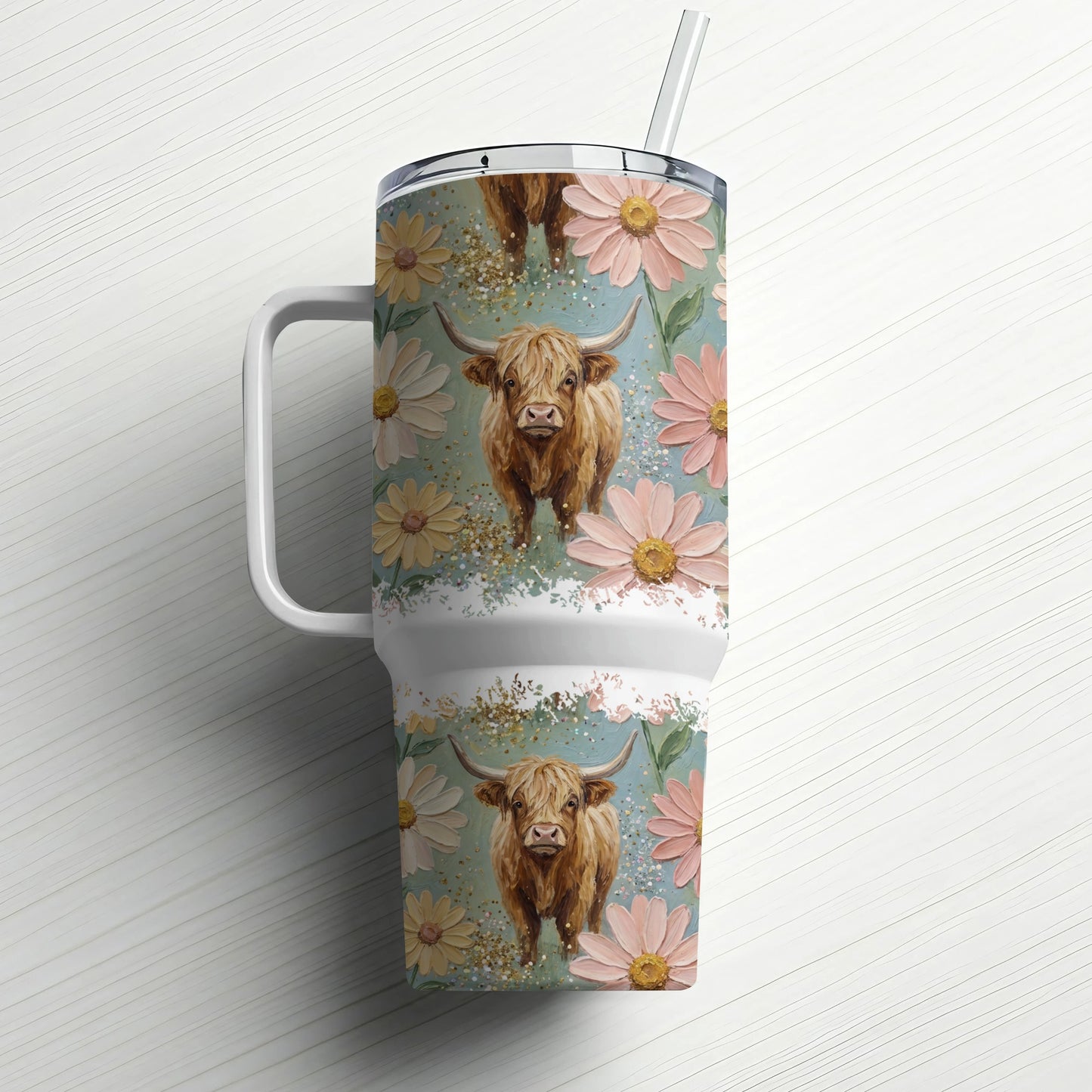 Highland cow with flowers on a large tumbler with straw.