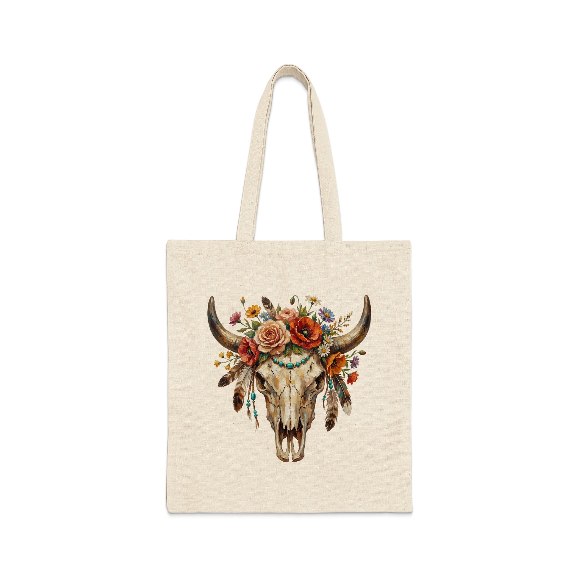 Tote bag with a decorative steer skull featuring flowers and feathers.