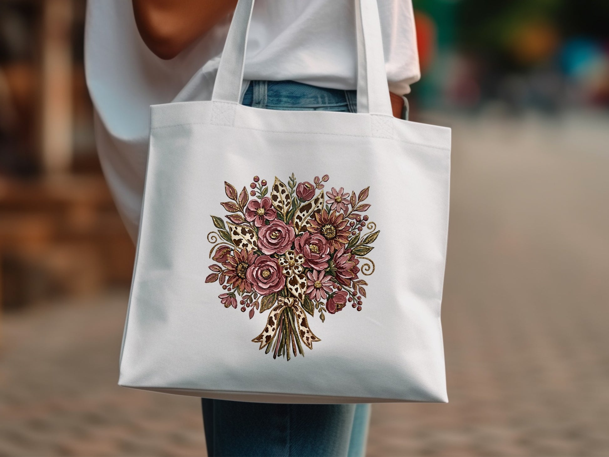 White tote bag with a pink and brown floral bouquet design.