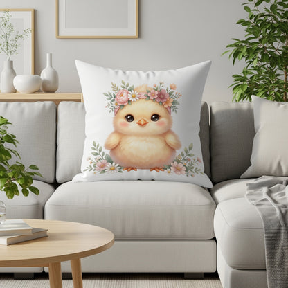 Fluffy chick wearing a floral crown on a pillow on a couch.