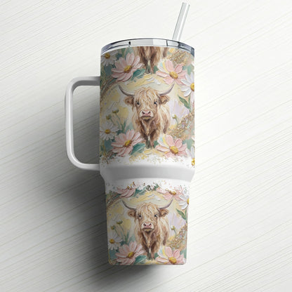 Tumbler with Highland cow and floral pattern.