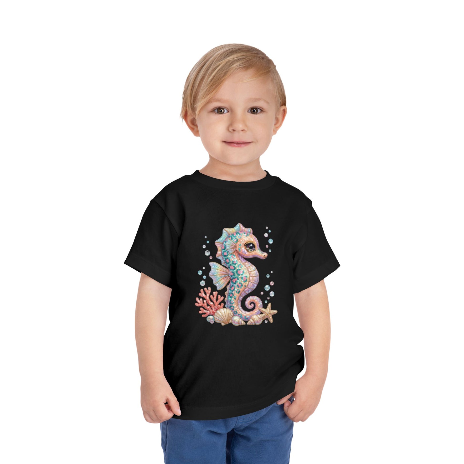 Black t-shirt with a cartoon seahorse, coral, and starfish graphic.