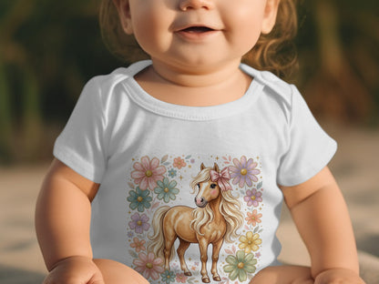 Baby wearing white bodysuit with a blonde horse and floral design.