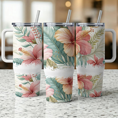 Three tumblers with hibiscus floral pattern and straws.