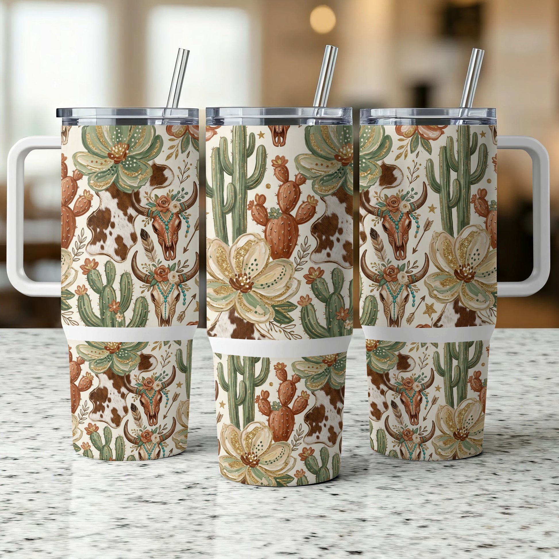 Three tumblers with a western floral, cactus, and steer skull pattern.