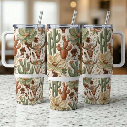 Three tumblers with a western floral, cactus, and steer skull pattern.