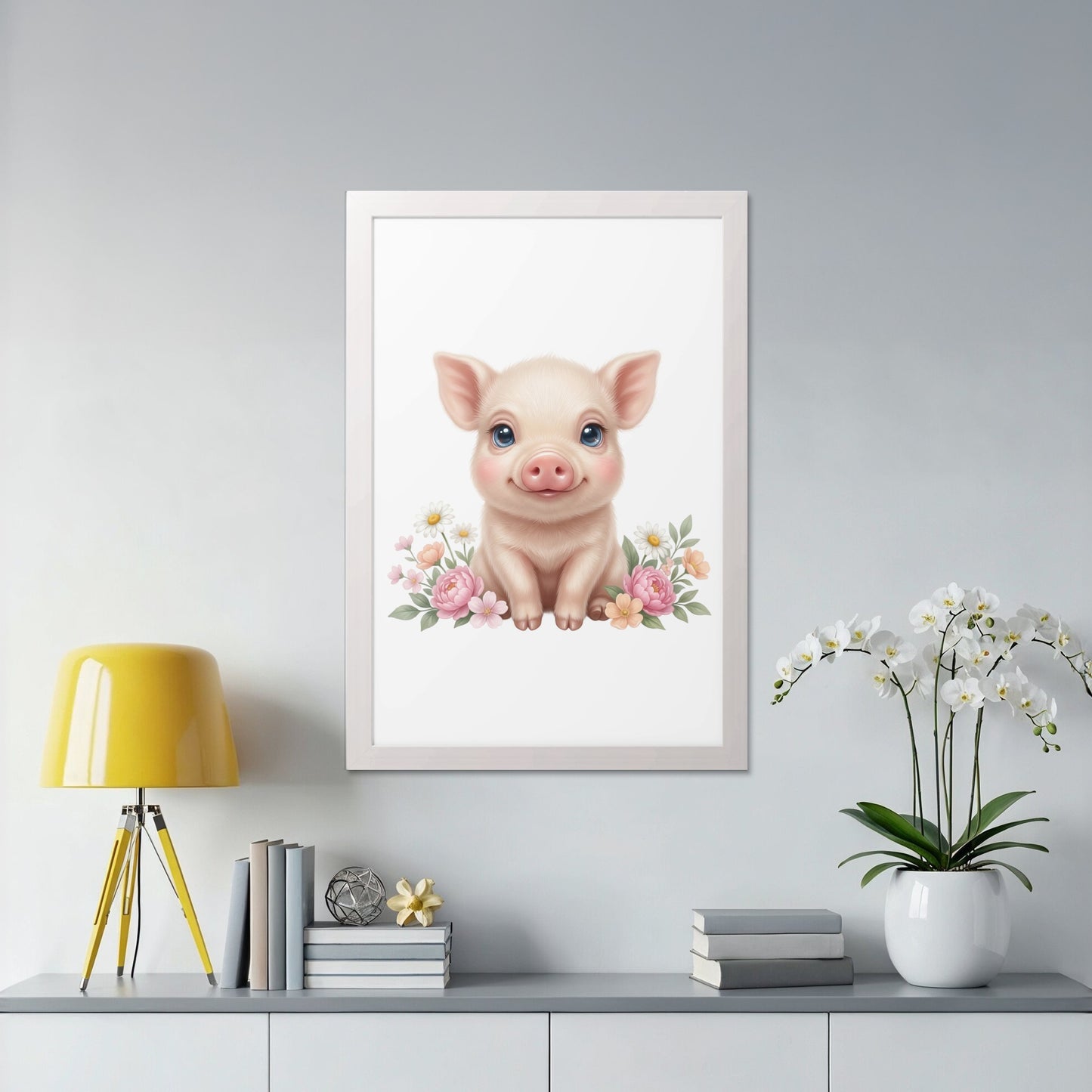 Pink piglet with blue eyes and flowers, in a white framed print.