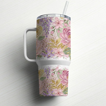 White tumbler with a floral pattern of pink and purple flowers and gold accents.