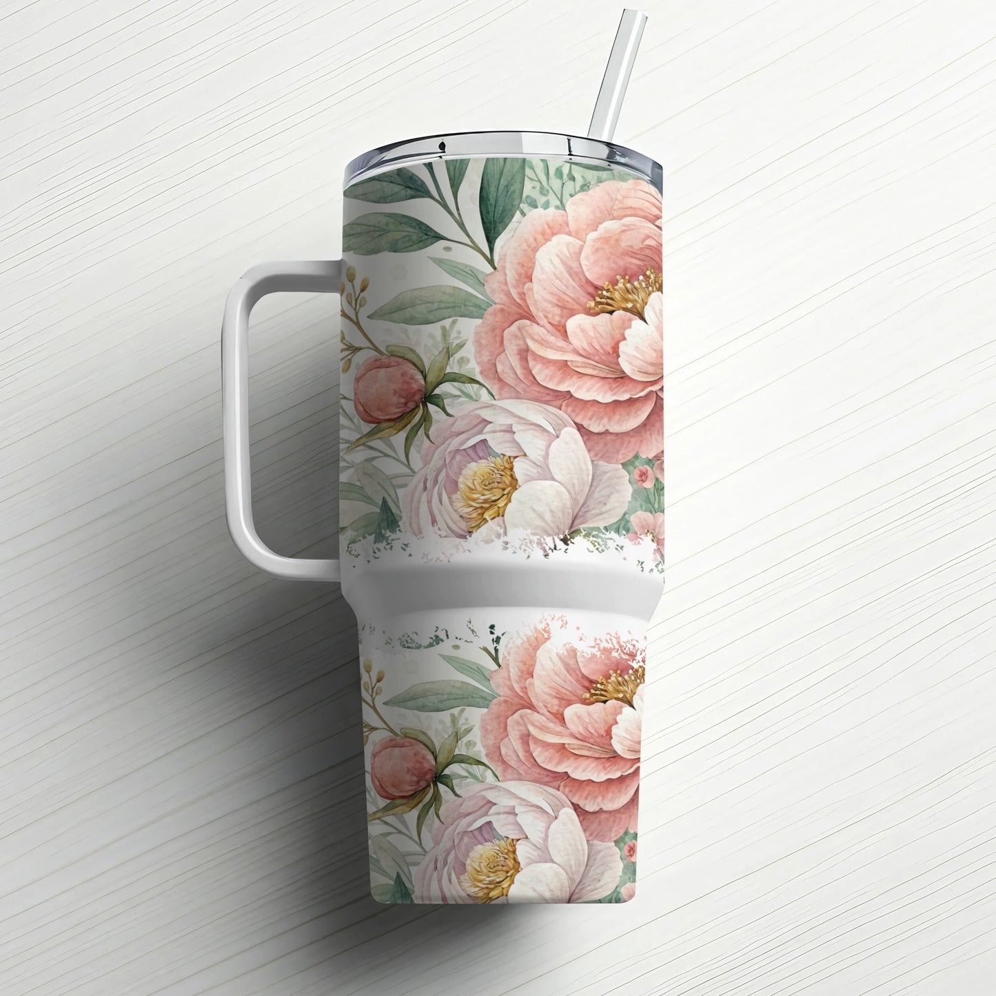 White tumbler with pink peonies and green leaves, and a straw.