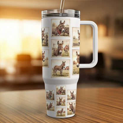 Tumbler featuring a collage of postage stamps with donkey illustrations.