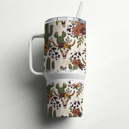 White tumbler with a rustic desert skull and floral pattern, featuring a straw.