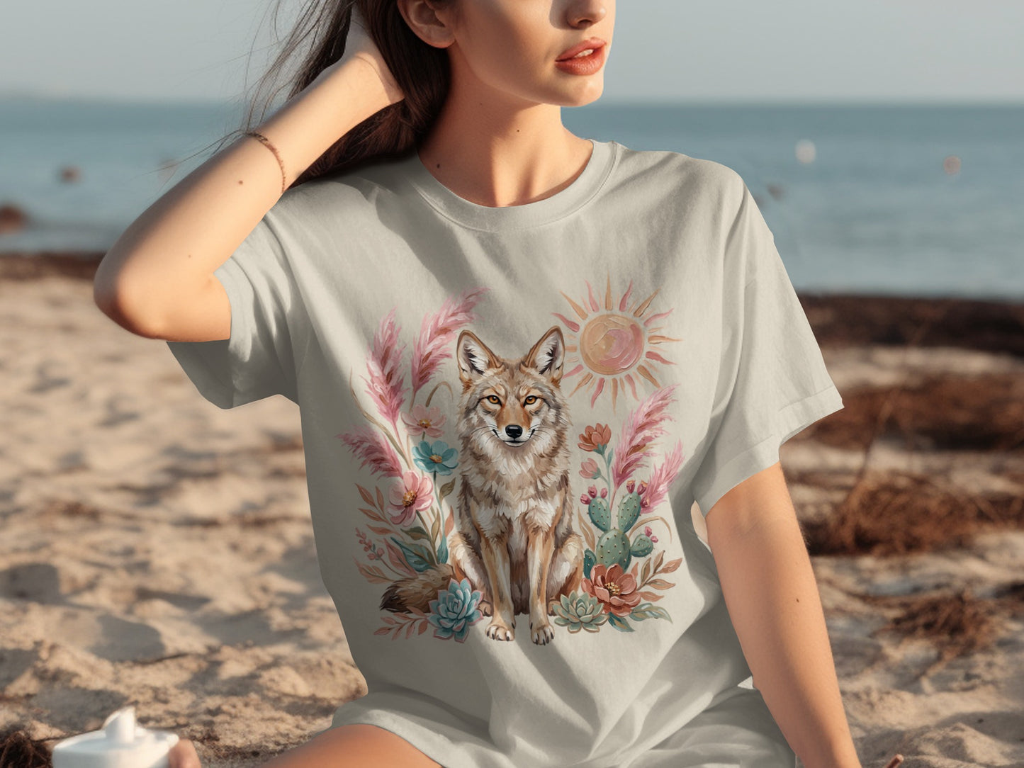 T-shirt with coyote, cactus, and floral design.