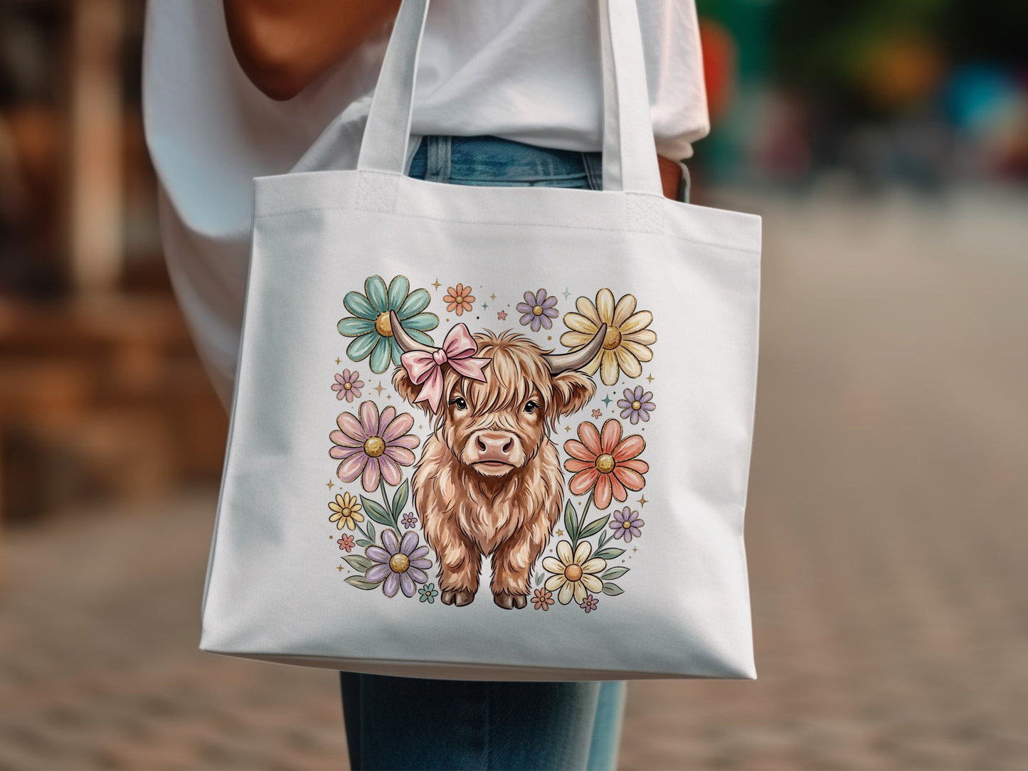 White tote bag with Highland cow and pastel flowers design.