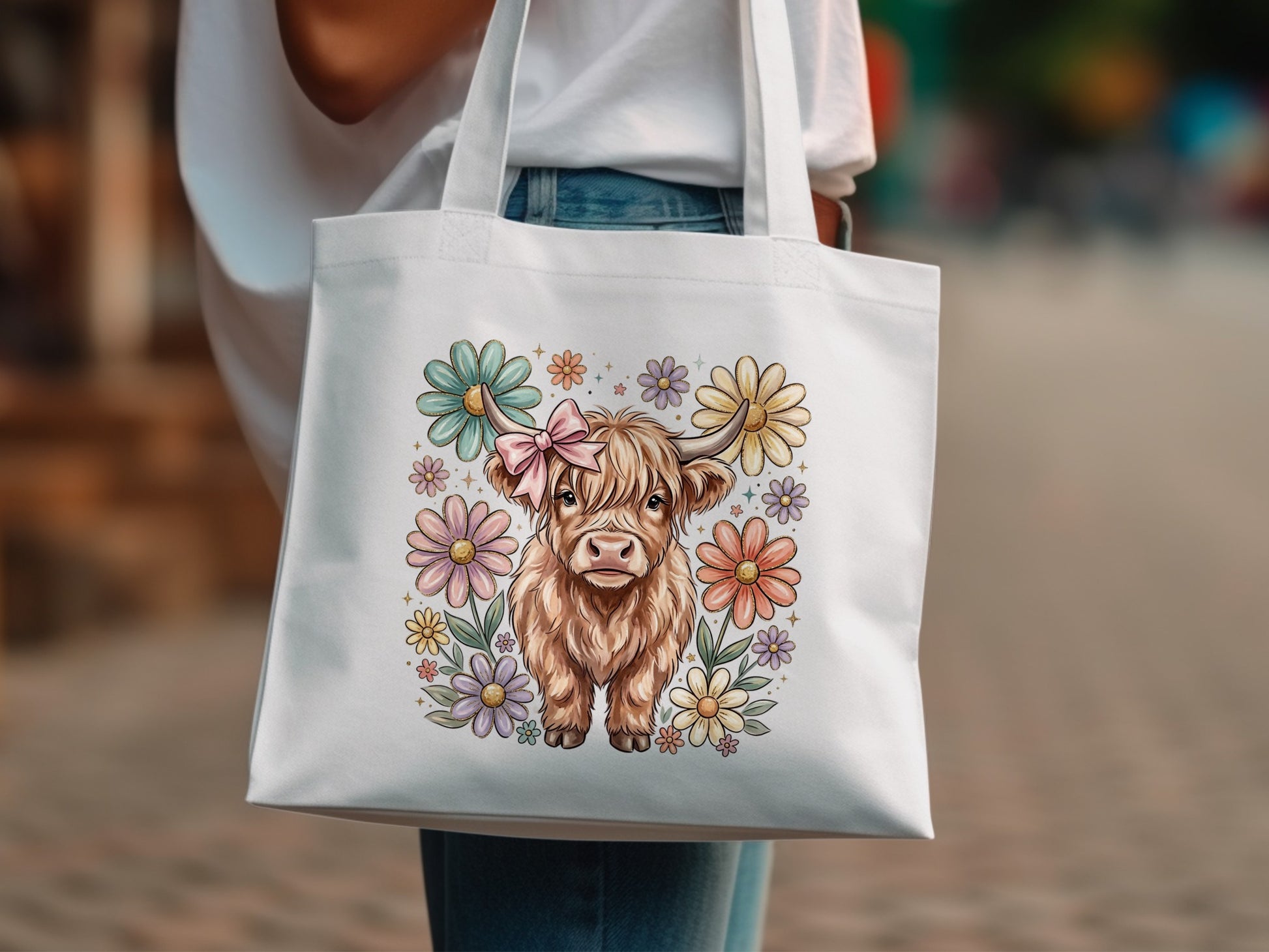 White tote bag with Highland cow and pastel flowers design.
