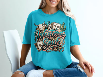 Teal t-shirt with "Western Soul" graphic featuring a bull skull, cards, and cactus.